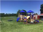 Playground in the grass at Clinton Lake Camping - thumbnail