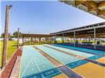 Four rows of shuffleboard courts at SANDBAR RV RESORT - thumbnail