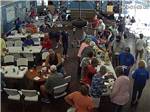 People eating at a pot luck at PALMDALE RV RESORT - thumbnail