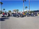 A group of motorcycles in a line at PALMDALE RV RESORT - thumbnail