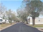 One of the paved roads at PALMDALE RV RESORT - thumbnail
