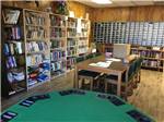 A poker table and library at PALMDALE RV RESORT - thumbnail