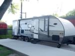 View of a paved RV site at South Main RV Park - thumbnail