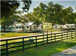 View larger image of A path with a wooden fence at SOUTHERN TRAILS RV RESORT image #4