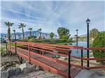 View larger image of A wooden foot bridge over water at CATALINA SPA AND RV RESORT image #9