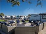 Chairs around a fire pit at Casa Grande RV Resort & Cottages - thumbnail