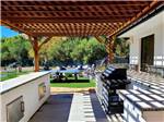 View larger image of The covered barbecue area at VERDE RIVER RV RESORT  COTTAGES image #9