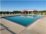 Pool area with lounge chairs at Heavenly Hills Resort - thumbnail