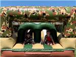 Kids playing on an inflatable slide at O'SULLIVAN SPORTSMAN RESORT (CAMPING RESORT) - thumbnail