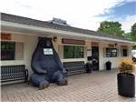 A statue of a bear in front of the office building at MILL CREEK RV PARK & VACATION RENTALS - thumbnail