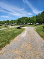 Open RV space with panic area at site Andover/Pymatuning Lake KOA - thumbnail
