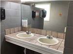 The clean bathroom sinks at WENDY OAKS RV RESORT - thumbnail