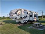 A fifth wheel parked on-site at BOLIVAR PENINSULA RV PARK - thumbnail