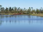 A view of the lake and the pier at DEAD LAKES PARK RV & CAMPGROUND - thumbnail