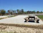 A picnic bench at a RV site at DEAD LAKES PARK RV & CAMPGROUND - thumbnail