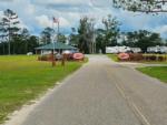 The front entrance gate with park signs on the fence at DEAD LAKES PARK RV & CAMPGROUND - thumbnail