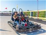 Mother and son riding a go kart at Pigeon Forge Department Of Tourism - thumbnail