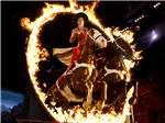 A horse and rider jump thru a ring of fire at Pigeon Forge Department Of Tourism - thumbnail