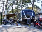 Travel trailer, motorcycle and golf cart at a site at Myrtle Beach Campgrounds - thumbnail