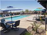 View larger image of The swimming pool with seating at COPPER MOUNTAIN RV PARK image #1