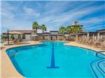 The swimming pool with lounge chairs at VISTA DEL SOL RV RESORT - thumbnail