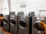 A row of coin-operated clothes dryers at TULSA RV RANCH - thumbnail