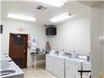 View larger image of Laundry room with washers and dryers at SUN RESORTS RV PARK image #8
