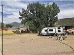 View larger image of A travel trailer in a gravel RV site at SADDLEBACK RV image #8