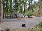 A fifth wheel parked in a paved RV site at CRYSTAL GOLD MINE & RV PARK - thumbnail