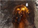 A group of people walking in the gold mine at CRYSTAL GOLD MINE & RV PARK - thumbnail