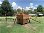The wooden ship shaped playground equipment at TRIPLE CREEK CAMPGROUND - thumbnail