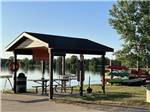View larger image of Patio area with picnic tables at SOARING EAGLE HIDEAWAY RV PARK image #4
