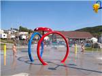 Colorful rings in splash pad at Bas-St-Laurent Campground - thumbnail