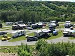 RVs and cars in sites at Bas-St-Laurent Campground - thumbnail