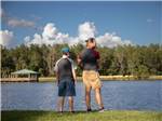 A man and boy fishing at Natalbany Creek Campground & RV Park - thumbnail