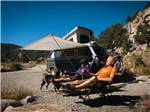 View larger image of People sitting outside of their VW van at COLORADO PARKS  WILDLIFE image #3