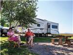 Couple at their campsite - thumbnail