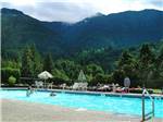 Swimming pool with outdoor seating at THOUSAND TRAILS CULTUS LAKE - thumbnail