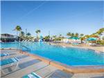 Lounge chairs around the expansive pool - thumbnail