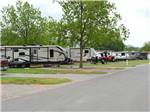View larger image of Trailers at campsite at PECAN GROVE RV RESORT image #3