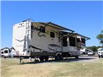 A trailer in an RV site at PECAN GROVE RV RESORT - thumbnail