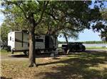 A travel trailer in a gravel site at BRACKENRIDGE RECREATION COMPLEX-TEXANA PARK & CAMPGROUND - thumbnail