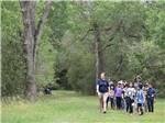 A group of kids and staff taking a hike at BRACKENRIDGE RECREATION COMPLEX-TEXANA PARK & CAMPGROUND - thumbnail