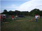 A group of people playing cornhole at SHENANDOAH VALLEY CAMPGROUNDS - thumbnail