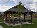 Patio area with picnic tables at MOUNTAIN VALLEY RV RESORT - thumbnail