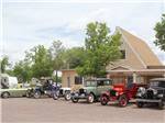 A row of classic cars in front of the main building at GRAND CANYON VIEW RV - thumbnail