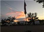 Trailers parked in gravel sites at sunset at GRAND CANYON VIEW RV - thumbnail