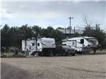 Trailers with tow vehicle in campsites at GRAND CANYON VIEW RV - thumbnail