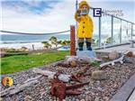 View larger image of A statue next to an RV site at PACIFIC SHORES MOTORCOACH RESORT image #3