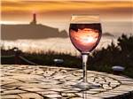 View larger image of A wine glass overlooking the ocean at PACIFIC SHORES MOTORCOACH RESORT image #4